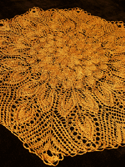 Lacy Doily hand knit with reeled silk yarn by Tabi Ferguson
