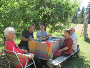 At the table enjoying the food and friendship