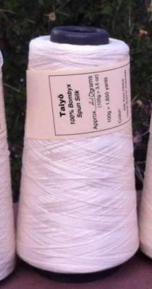 Taiyō - 100% Bombyx Spun Silk Yarn 30/2, lace/thread weight (on cone): click to enlarge
